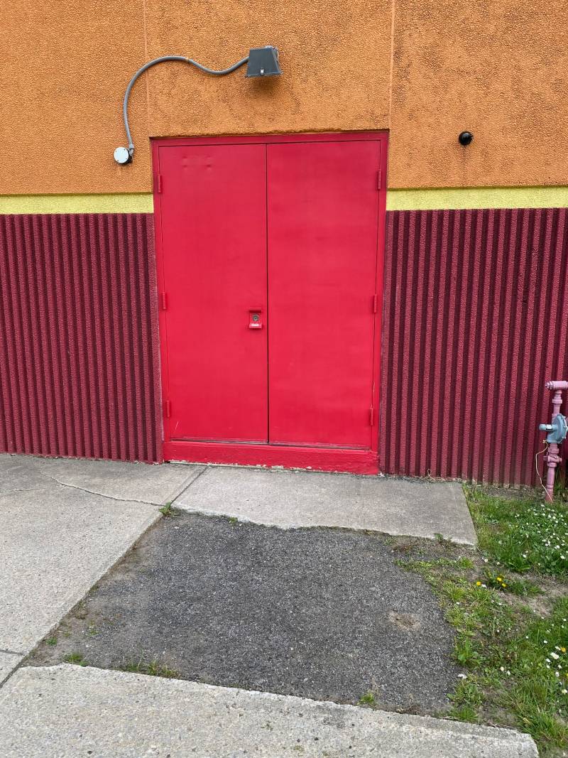 Red door at theater, Batavia