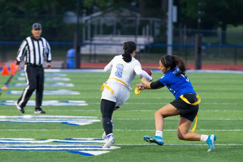 Senior Cesia Isamay catches a Eastridge flag pull to stop yard advancement on the play