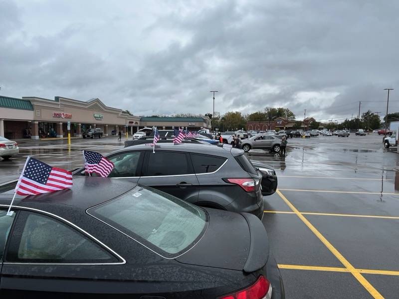 Cars with flags for Steve Vernaccini