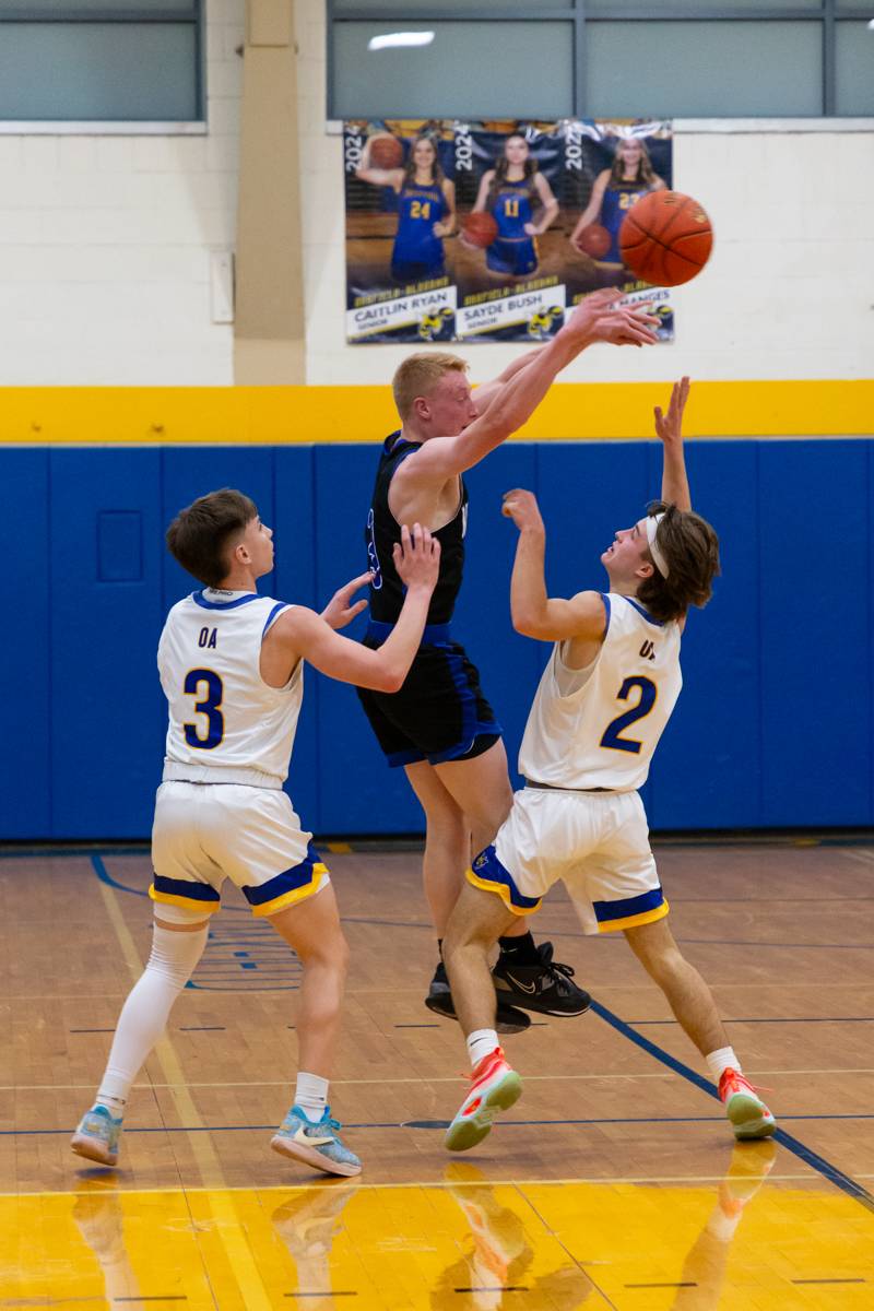 Kendall player double teamed by Oakfield defenders.  Photo by Steve Ognibene