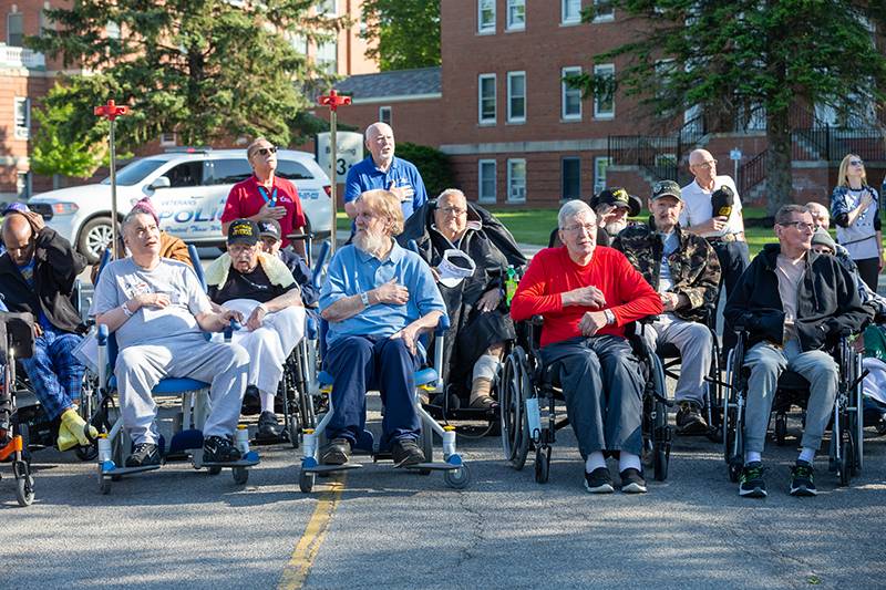 veterans from the VA medical center outside for services