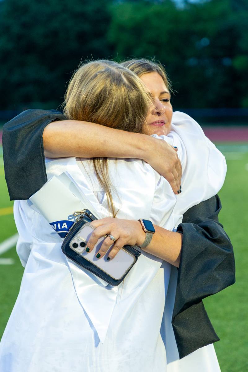 Senior Olivia Shell hugging English Teacher Kim Przybysz sharing a hugs and tears, saying good byes and good luck in college studying education.