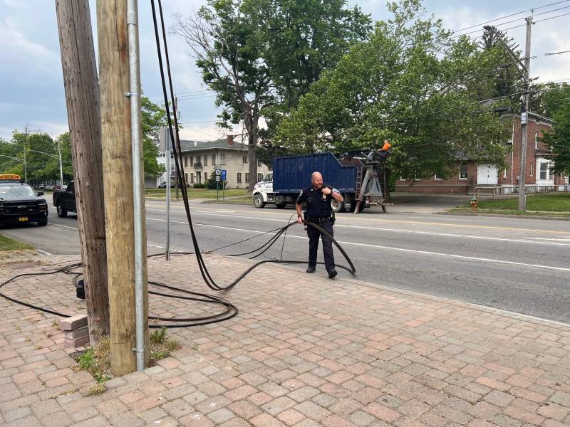 Wires on Main St., Batavia, with police officer