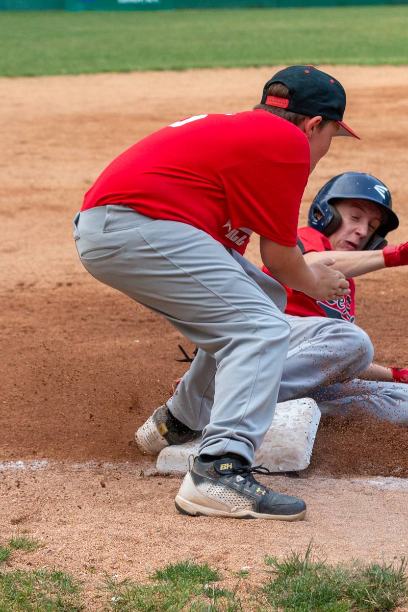 LeRoy player safe on third base. Photo by Steve Ognibene