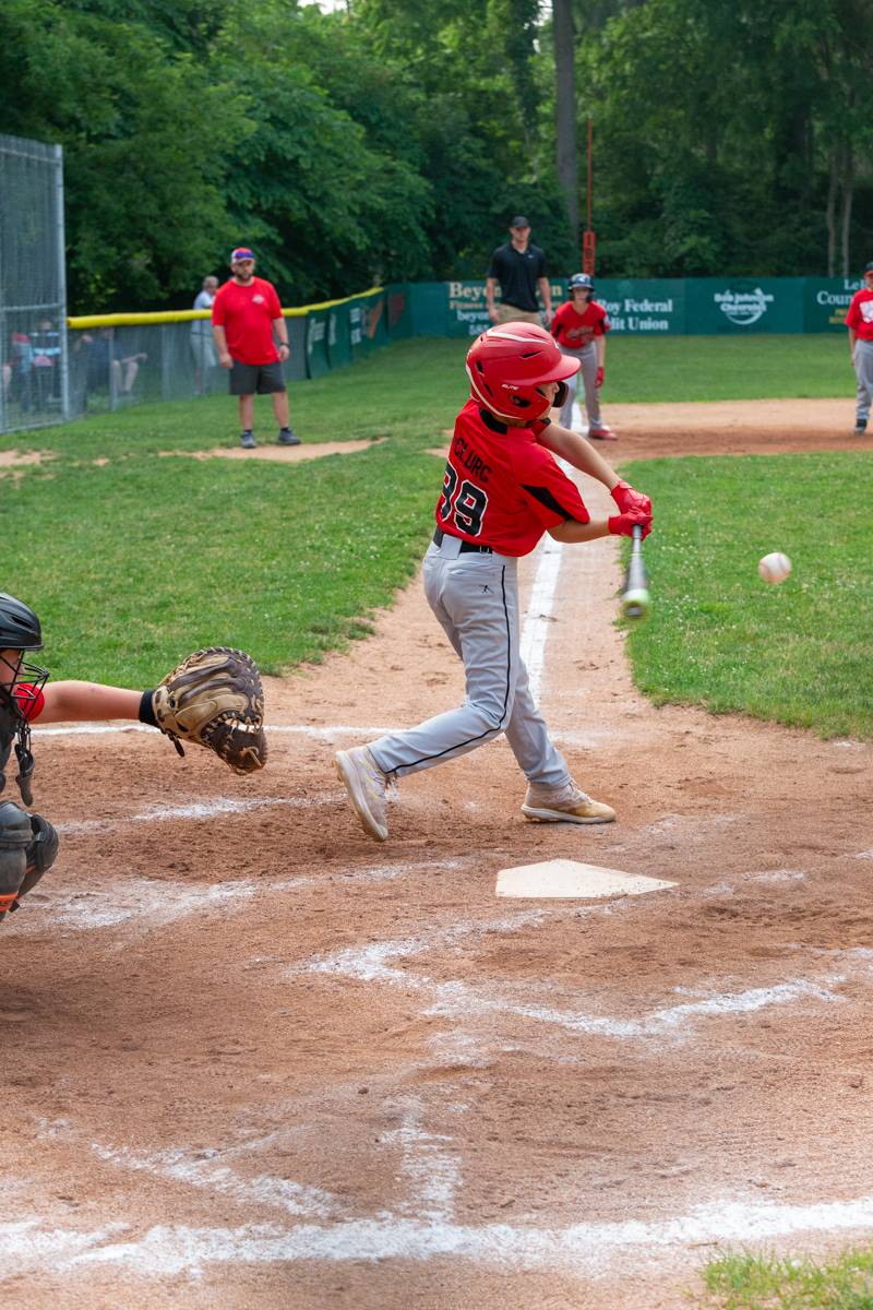 Another hit by LeRoy, late in the mercied game to get on base. Photo by Steve Ognibene