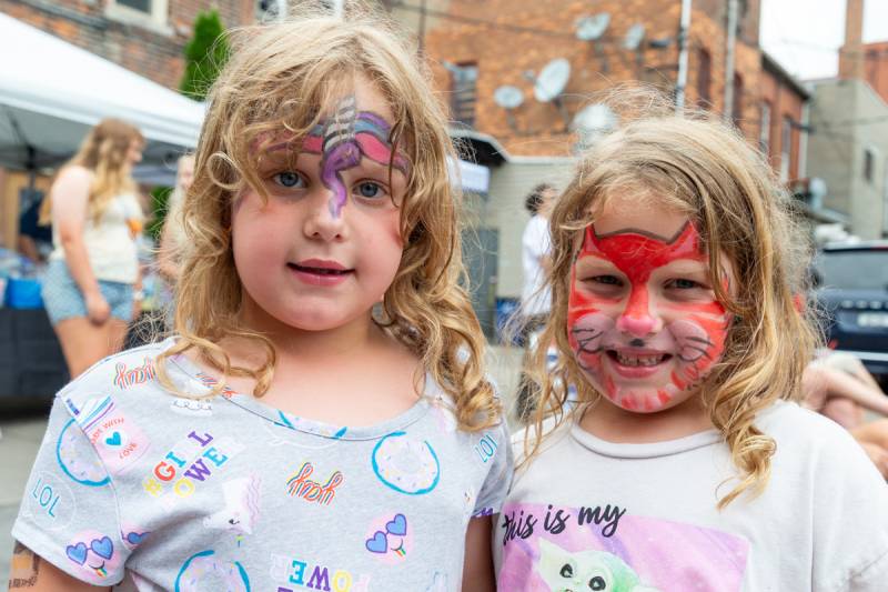 Face painted girls loved the activities for kids and the festival.  Photo by Steve Ognibene