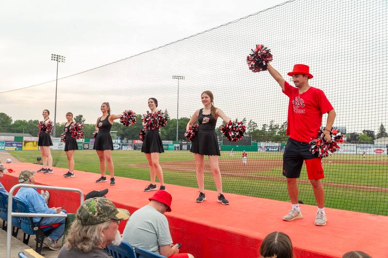 KMS Diamond Dance Team and Johnny Dog entertaining the crowd between innings.  Photo by Steve Ognibene