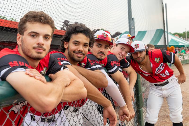 Muckdogs players pose in dugout.  Photo by Steve Ognibene