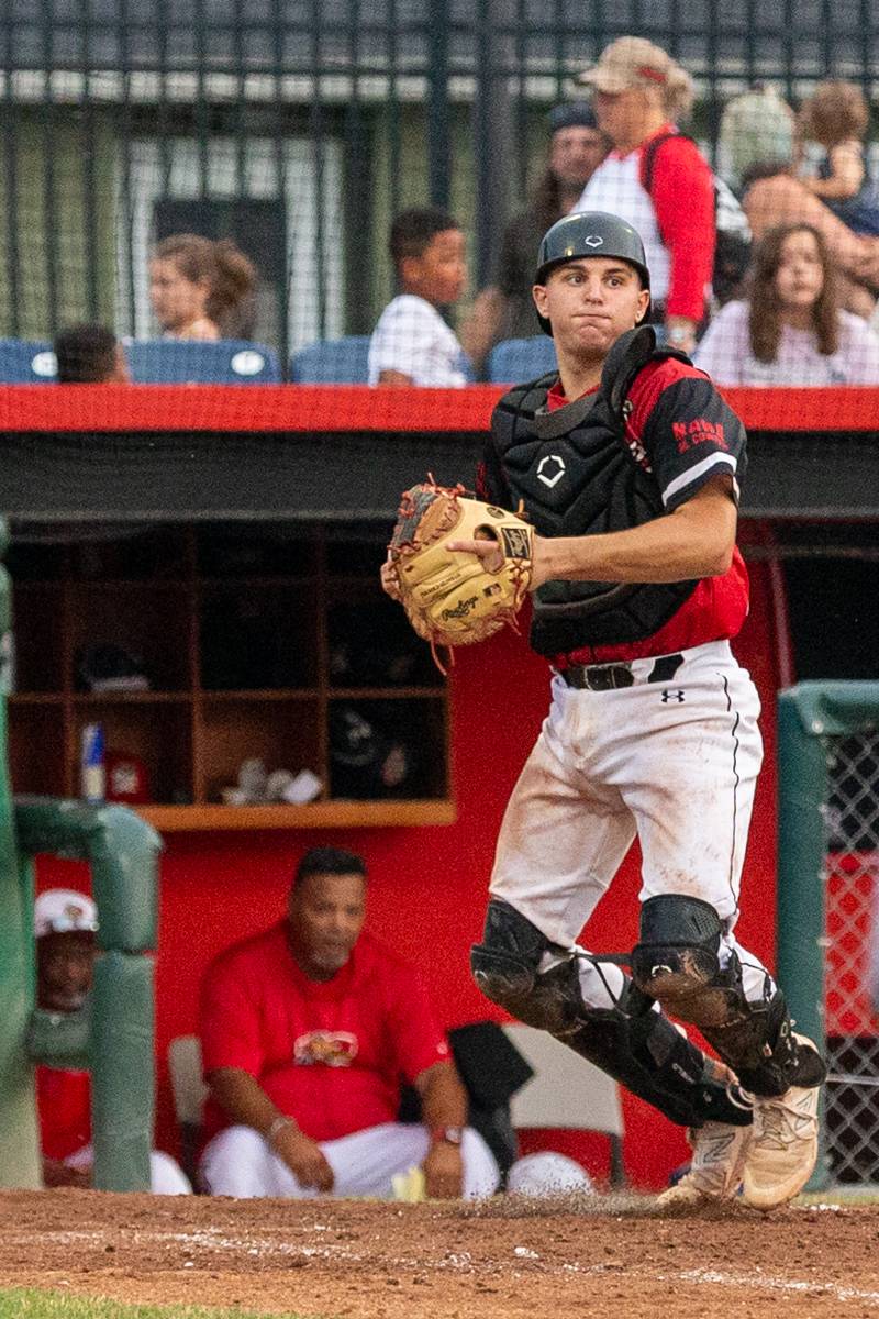 Muckdogs catcher making the out at home plate and turning to first base for a double play.  Photo by Steve Ognibene