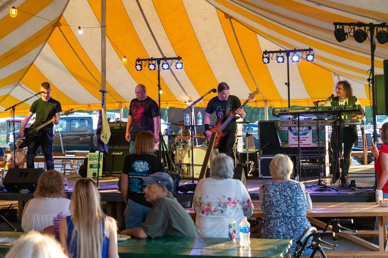 Knight Patrol band headlines the music tent, Sunday evening.  Photo by Steve Ognibene