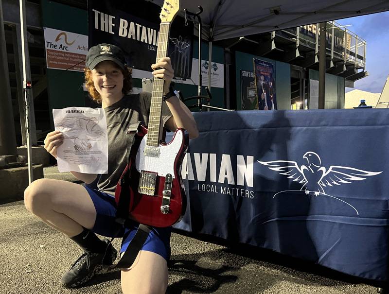 renee henning with guitar and drawing