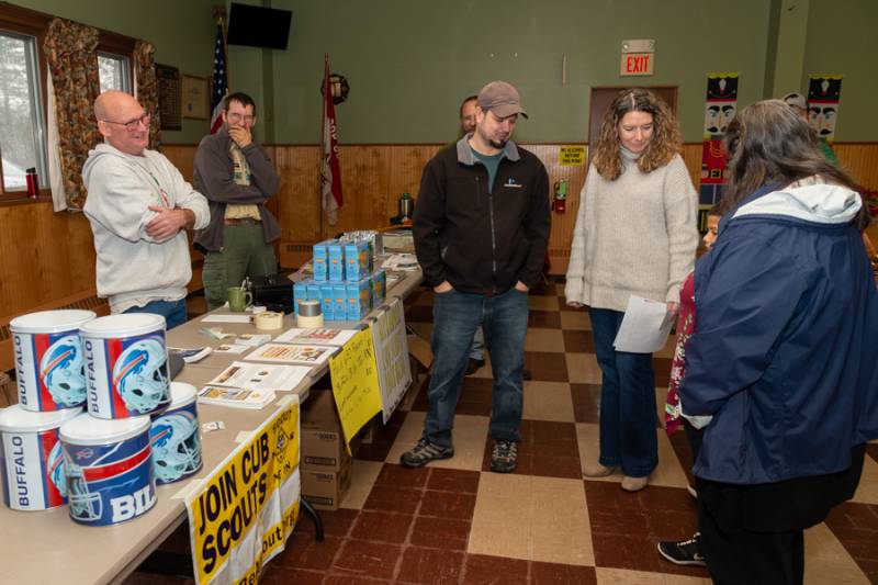 Committee members from Troop 650 giving information out for Boy Scouts.  Photo by Steve Ognibene