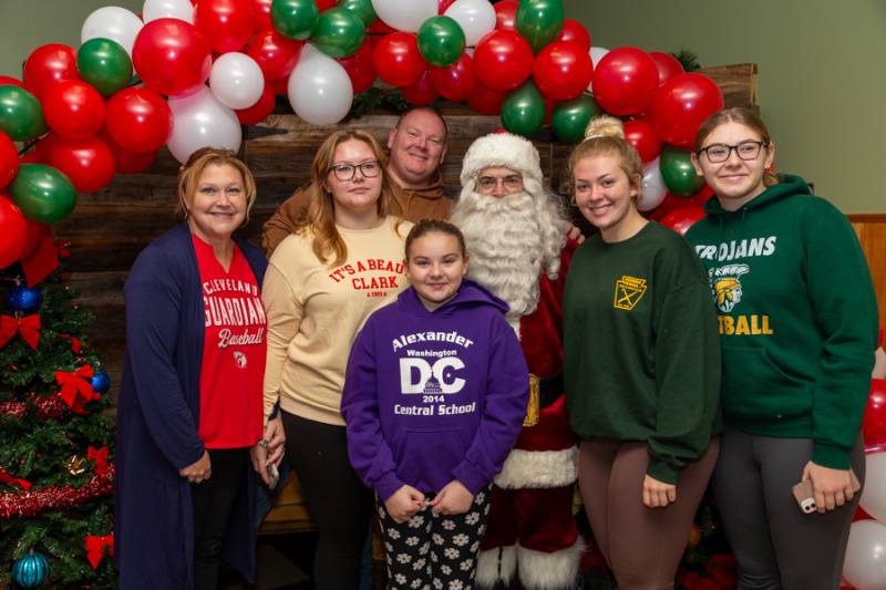 Many families gathered to eat breakfast, show local support and visit Santa.  Photo by Steve Ognibene