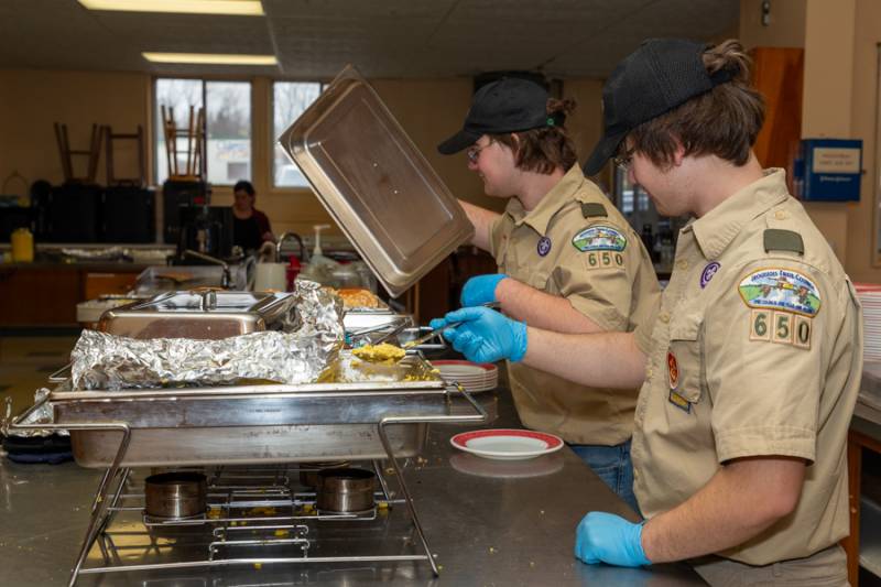 Some scouts serving to the public.  Photo by Steve Ognibene