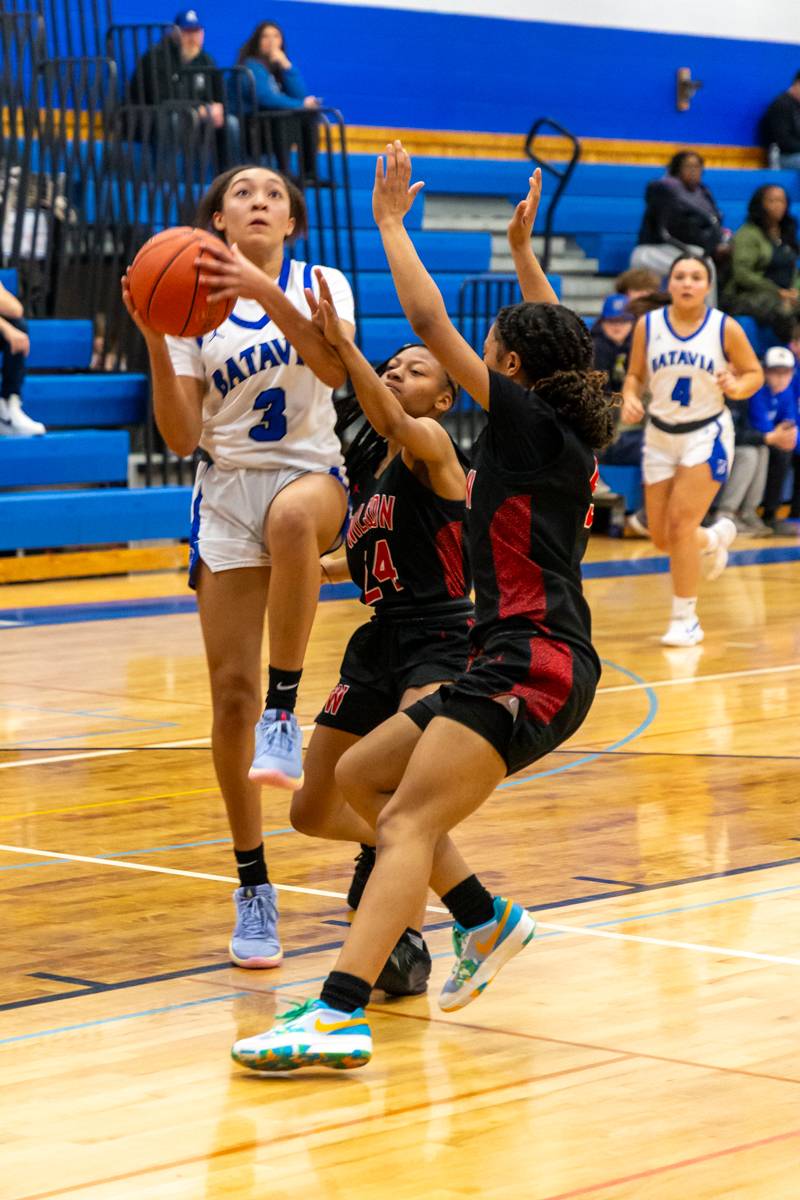 Karizma Wescott gets double teamed in the paint.  Photo by Steve Ognibene