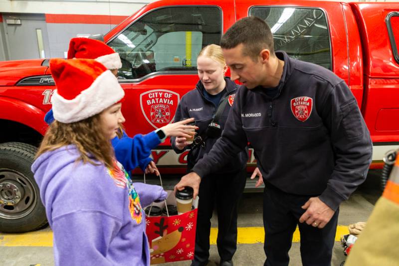 Batavia Fire Department staff receiving gifts. Photo by Steve Ognibene