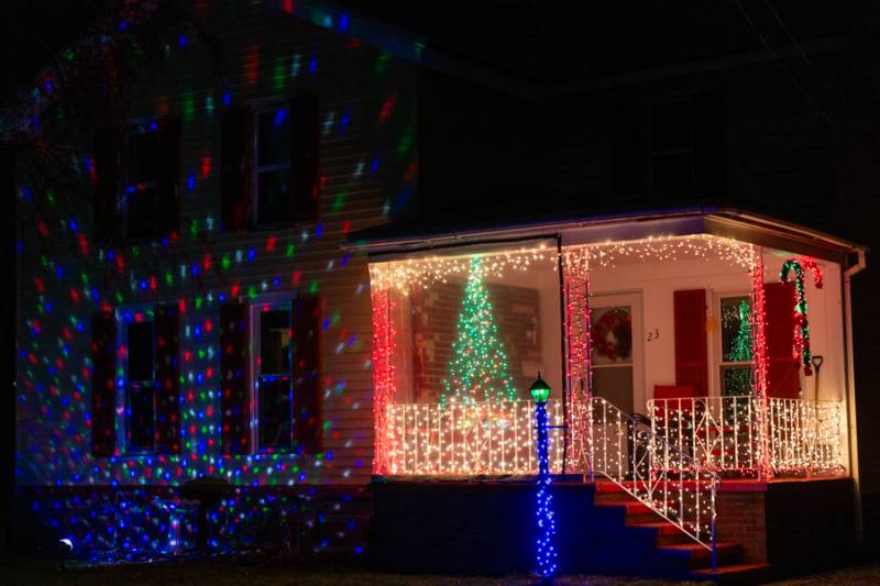 Oakfield resident lights  Photo by Steve Ognibene