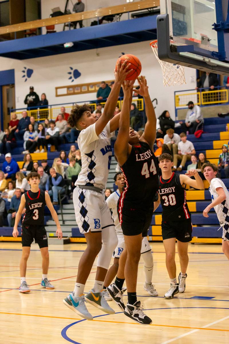 Batavia's Justin Smith and LeRoy's Jean Agosto scrapping for the ball . Photo by Steve Ognibene