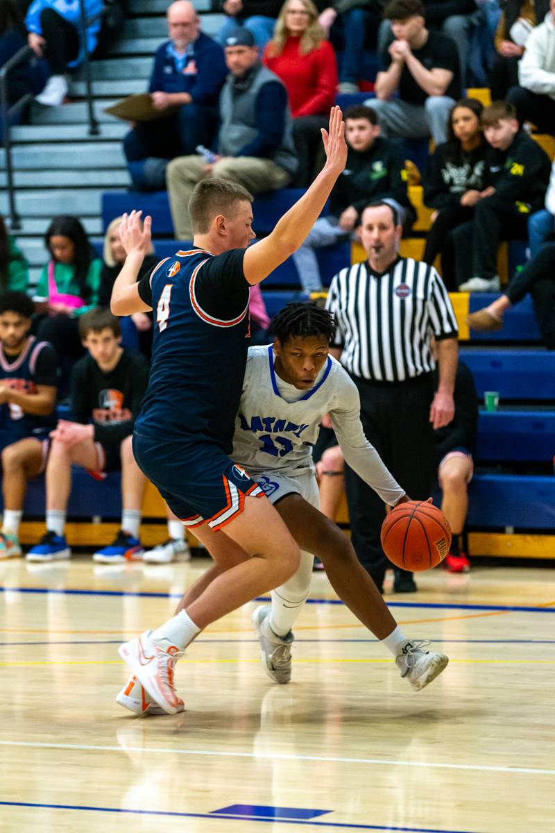 Estavon Lovett driving to the paint.  Photo by Steve Ognibene