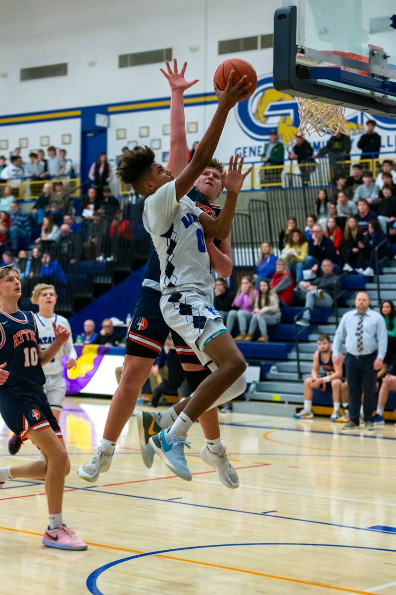 Justin Smith goes for a layup. Smith was named Tournament MVP. Photo by Steve Ognibene