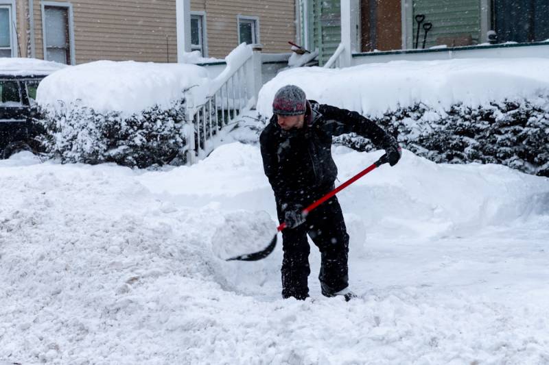 A local man shoveling heavy snow is challenging in single digits temperatures.  Photo by Steve Ognibene  