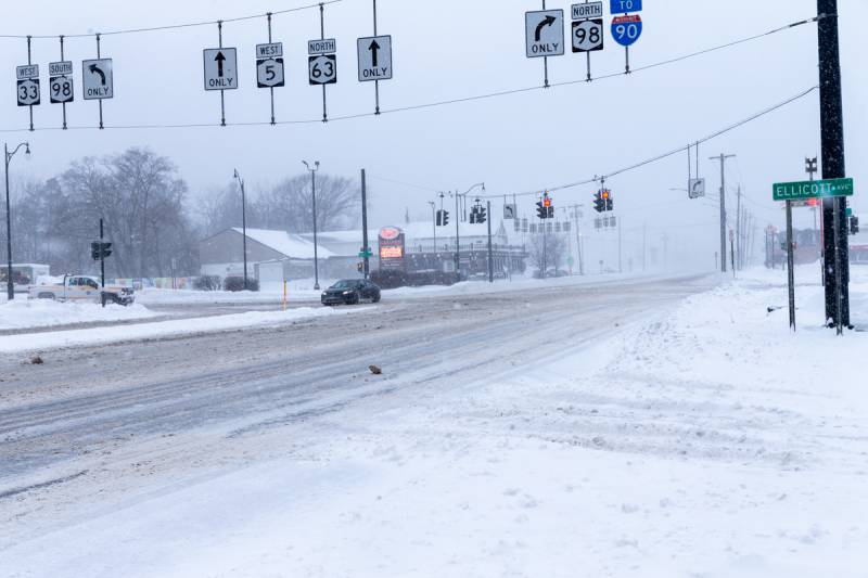Road signs near the main intersection of main and route 98 facing west showing little travel due to the storm. Photo by Steve Ognibene