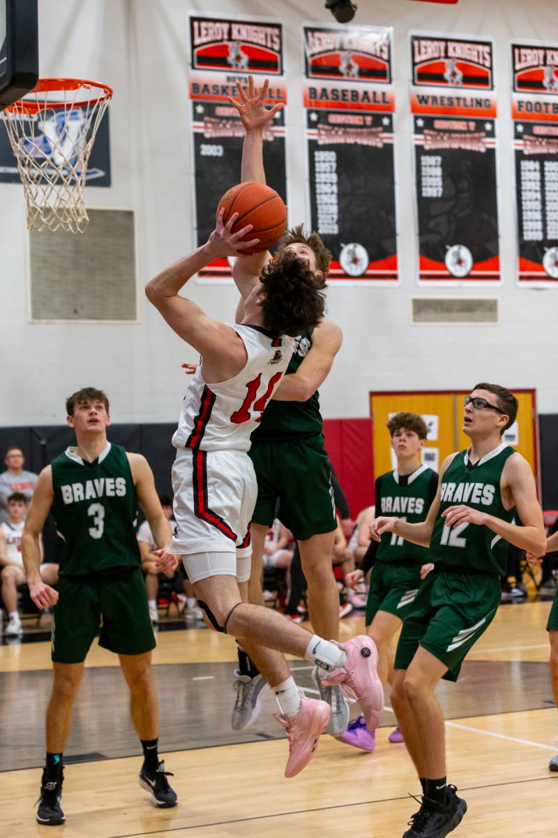 Adam Woodworth shoots from the field for two points.  Photo by Steve Ognibene