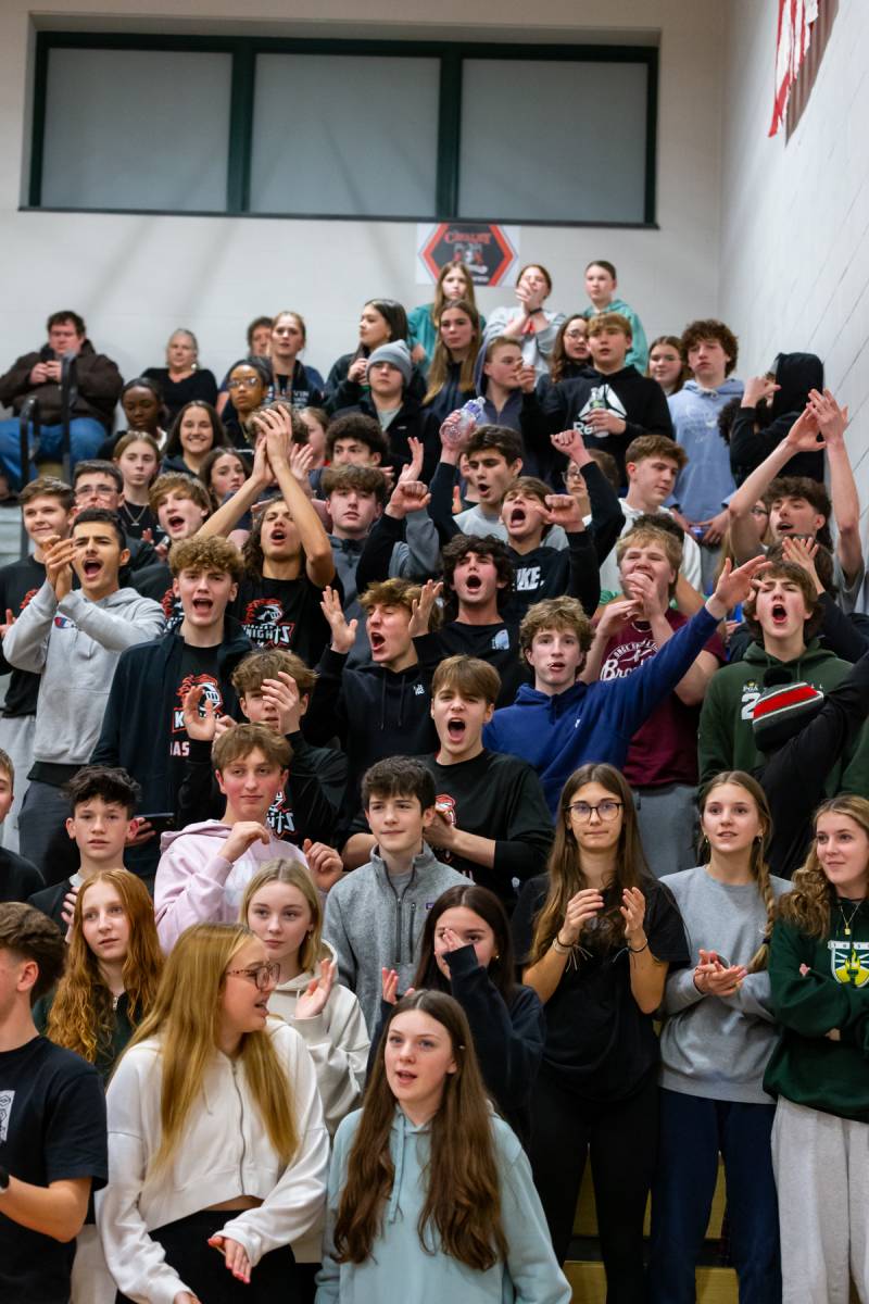 The Calvary cheering on Holly as the new all time point leader.  Photo by Steve Ognibene