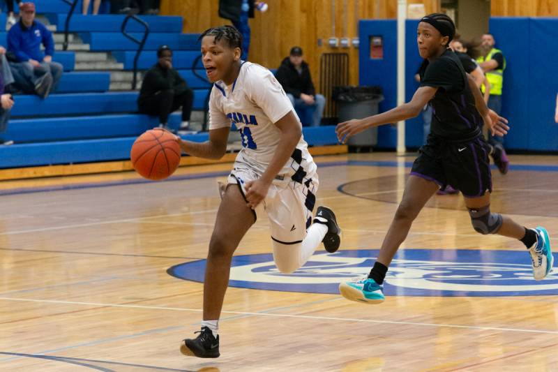 Estavon Lovett on a fast break.  Photo by Steve Ognibene