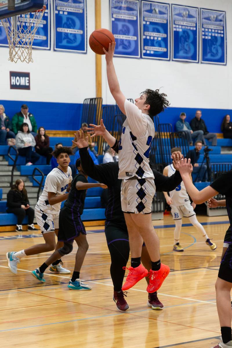 Aiden Bellavia driving to the hoop.  Photo by Steve Ognibene