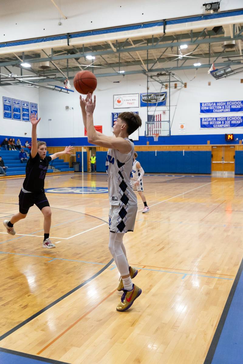 Carter Mullen shooting for three, Mullen had 25 points in the win over Odyssey.  Photo by Steve Ognibene