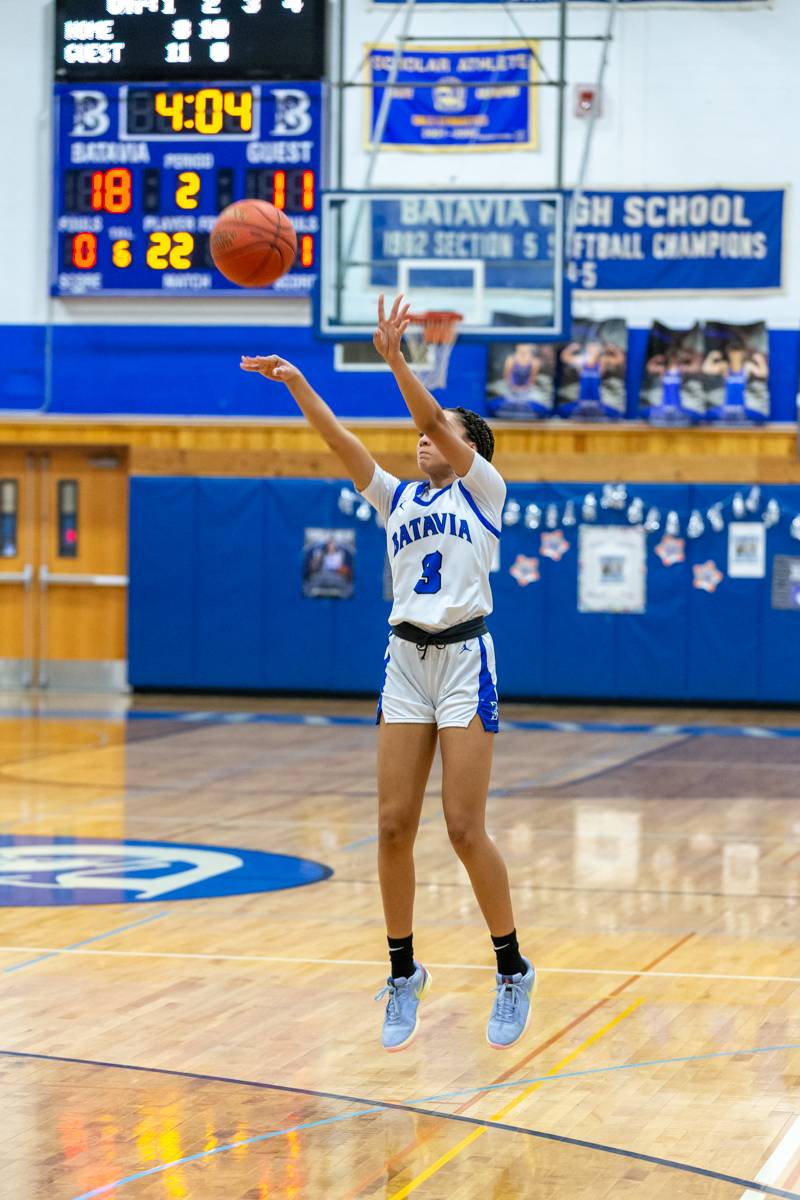 Karizma Wescott going for three points.  Photo by Steve Ognibene