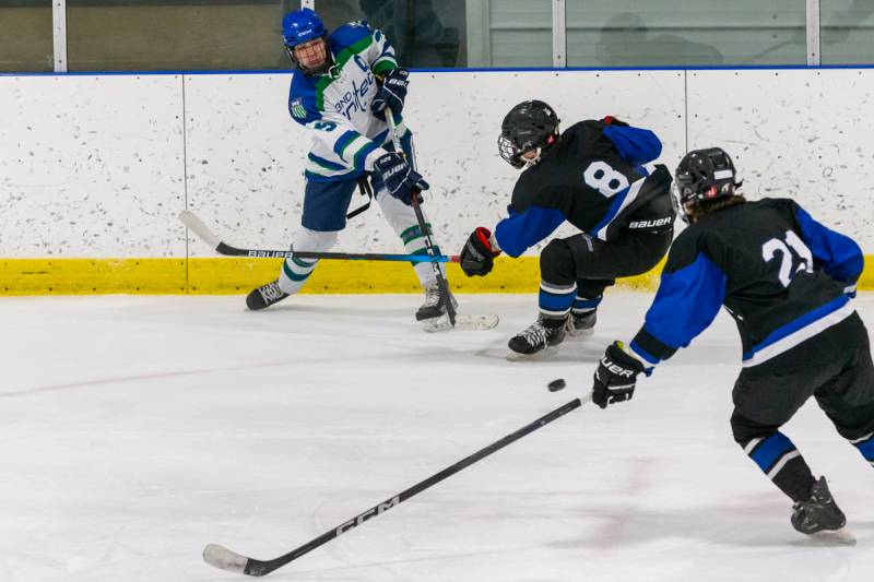 Joe DiRisio taking a shot on goal from the side boards.  Photo by Steve Ognibene