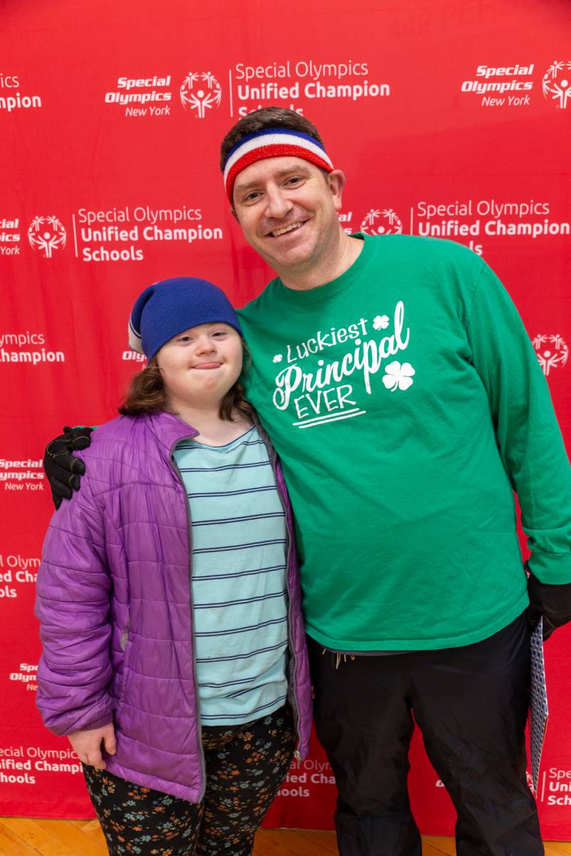Principal Paul Kesler and daughter prepare for the plunge.  Photo by Steve Ognibene