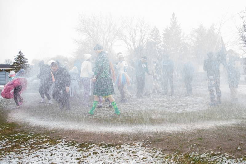 Participants going though the water spray.  Photo by Steve Ognibene