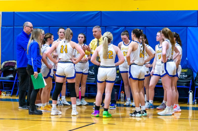 Coach Jeff Schlagenhauf talks to his team in the third quarter.  Photo by Steve Ognibene