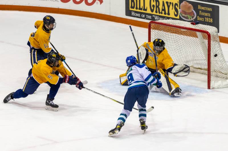 Sam Pies shoots a puck just wide in the first period.  Photo by Steve Ognibene