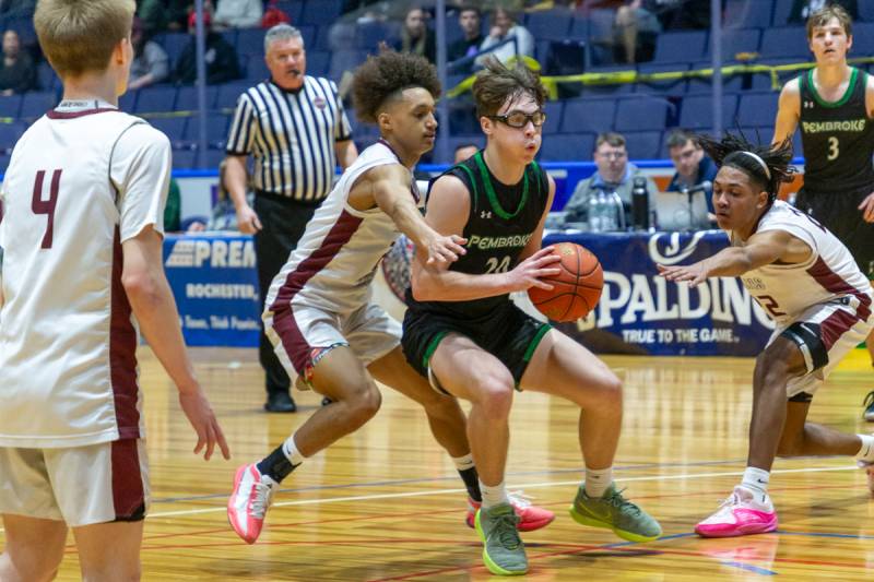 Tyson Totten double teamed in the paint.  Photo by Steve Ognibene