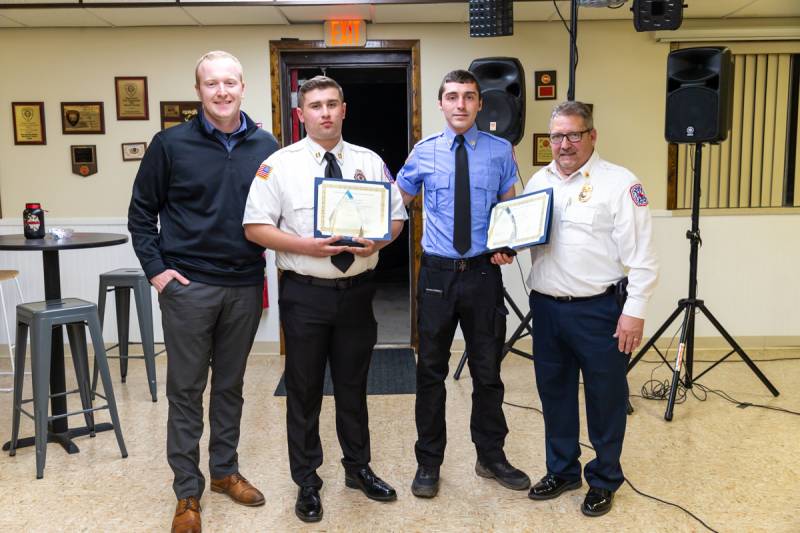L to R Tyler Lang presents Brandon Crossett and Michael Alexander with top training service hours awards  Photo by Steve Ognibene