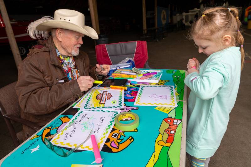 Jenna from Batavia with Mr. Scribbles doing an activity  Photo by Steve Ognibene