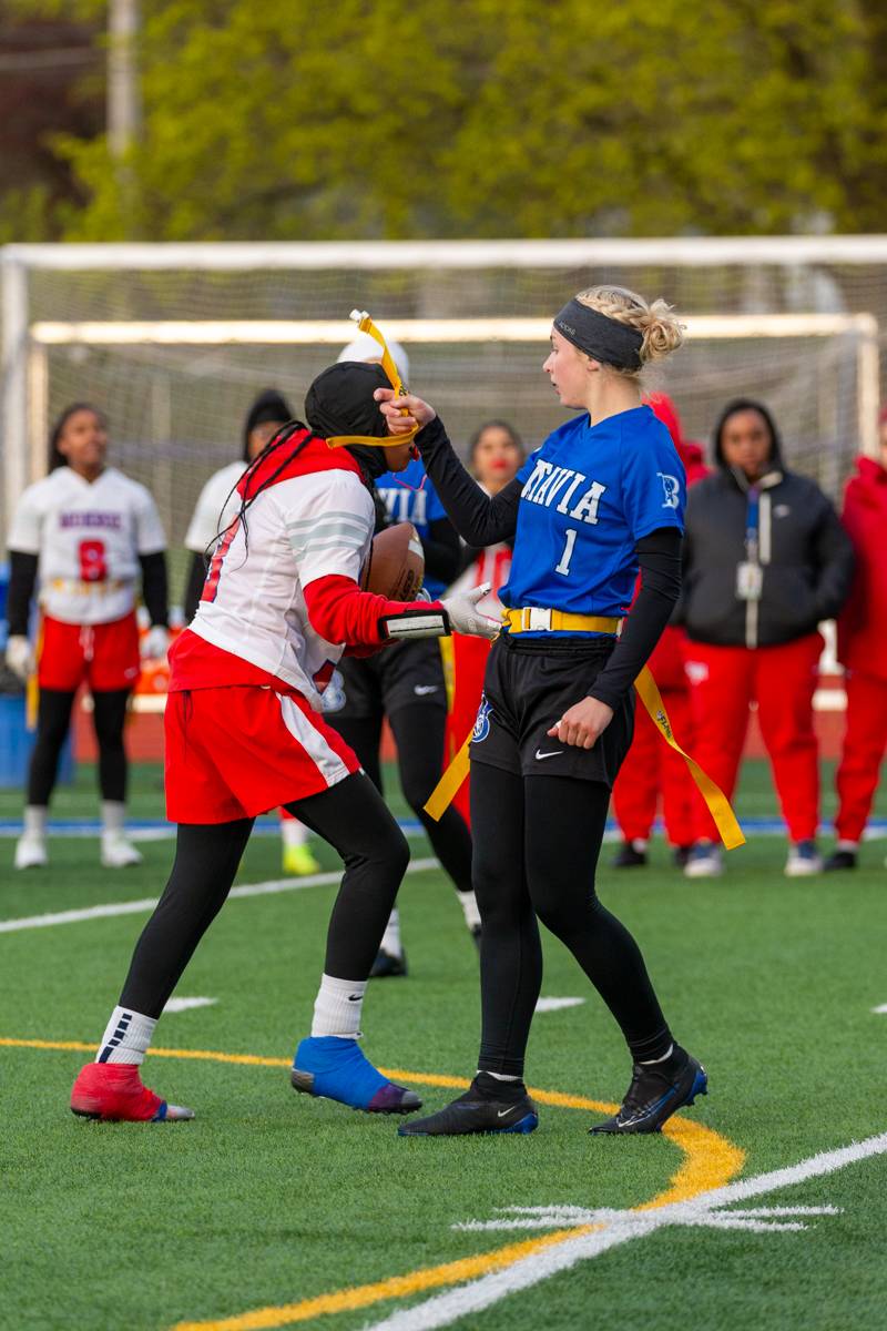 Kylee Brennan on the flag pull for defense.  Photo by Steve Ognibene