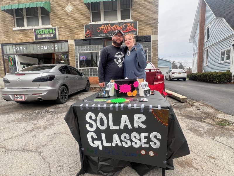 Couple selling sunglasses
