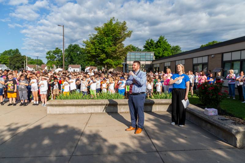 Pledge of allegiance outside John Kennedy Intermediate school  Photo by Steve Ognibene
