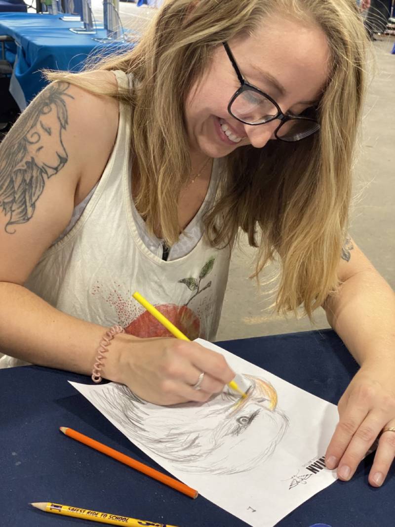 Brooke Follett drawing at the fair