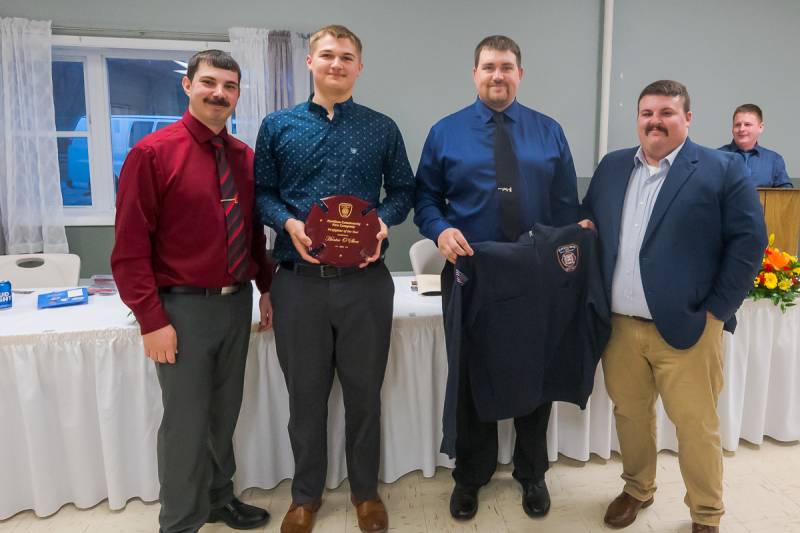 Chief Bryen Murrock, Firefigher of the Year Hunter O'Shea, 1st Asst. Chief Codey O'Neil, 2nd Asst. Chief Tom Garlock. Photo by Howard Owens.