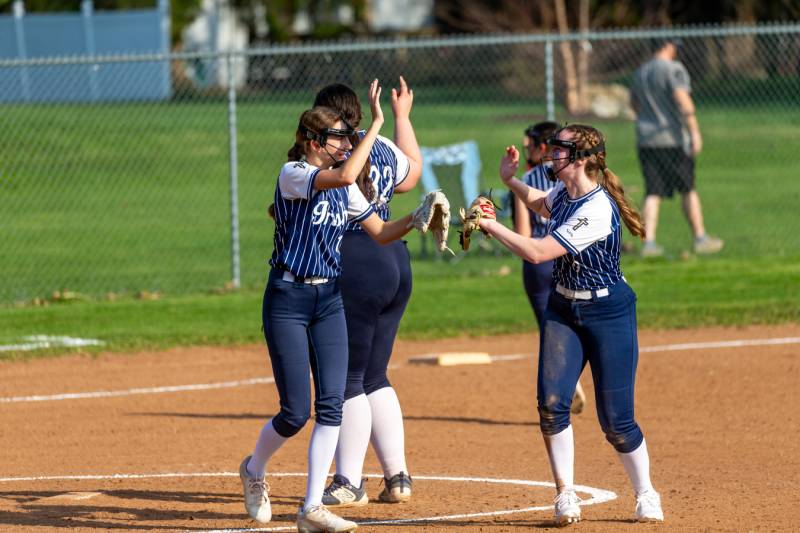 Notre Dame celebrate at the mound with thier first win of the season Wednesday afternoon in Elba 3-0.  Photo by Steve Ognibene