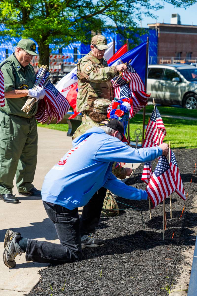 Placing of flags honoring veterans at the memorial wall at UMMC, Jerome Center   Photo by Steve Ognibene