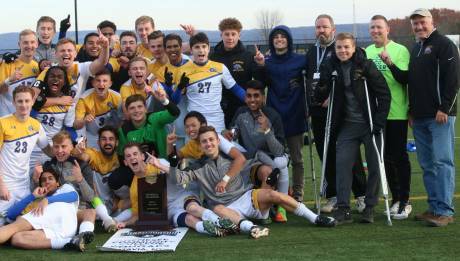 gcc_president_dr._james_sunser_far_right_joins_the_mens_soccer_team_for_a_team_photo_after_winning_their_first-ever_njcaa_title_in_herkimer_sunday.jpg