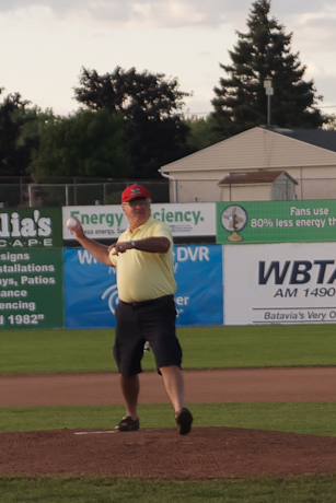 Lions Club President John Murray throws out the first pitch